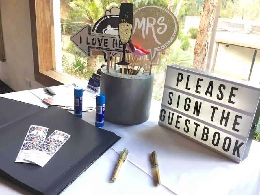Glam Photobooths - Album Signing Table with Please sign the guestbook sign