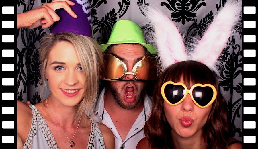 Glam Photobooths - Guests letting loose in our Classic Photo Booth